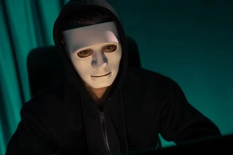 White criminal anonymous mask installing coding password encryption. Pecuniary. Stock-Fotos