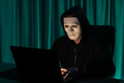 White criminal anonymous mask installing coding password encryption. Pecuniary. Stock-Fotos