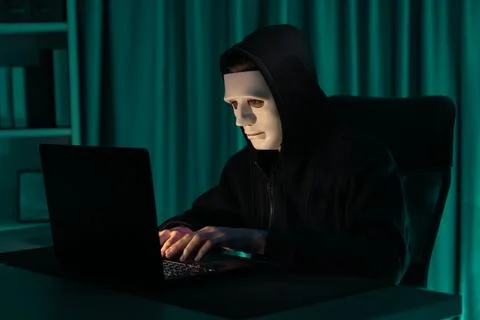 White criminal anonymous mask installing coding password encryption. Pecuniary. Stock Photos