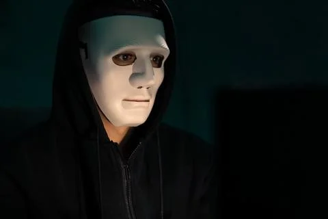 White criminal anonymous mask installing coding password encryption. Pecuniary. Stock Photos