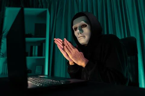 White criminal anonymous mask installing coding password encryption. Pecuniary. Stock Photos