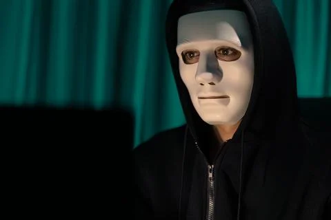 White criminal anonymous mask installing coding password encryption. Pecuniary. Stock Photos