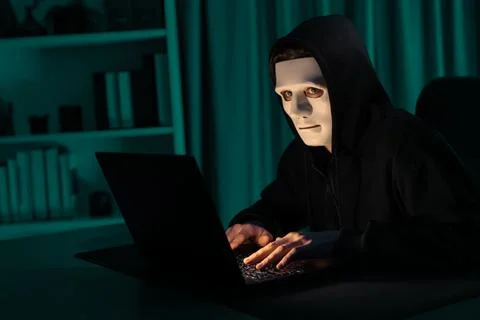 White criminal anonymous mask installing coding password encryption. Pecuniary. 스톡 사진