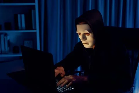 White criminal anonymous mask installing coding password encryption. Pecuniary. Stockfoto's