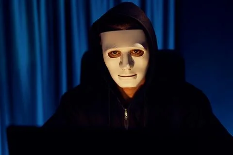 White criminal anonymous mask installing coding password encryption. Pecuniary. Stockfoto's