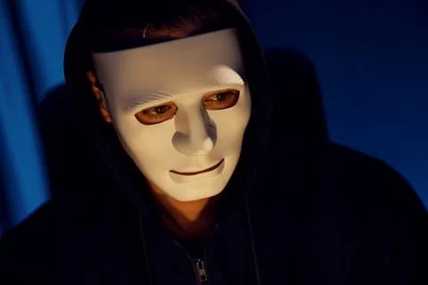White criminal anonymous mask installing coding password encryption. Pecuniary. Stockfoto's