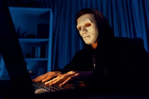 White criminal anonymous mask installing coding password encryption. Pecuniary. Stockfoto's