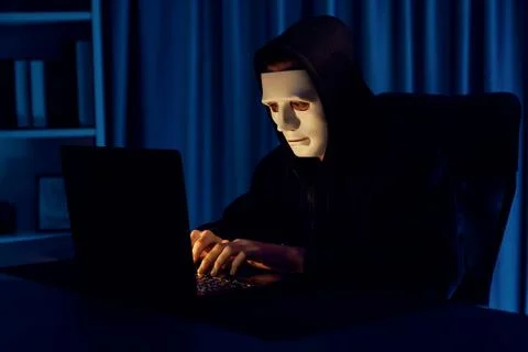White criminal anonymous mask installing coding password encryption. Pecuniary. Stockfoto's