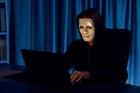 White criminal anonymous mask installing coding password encryption. Pecuniary. Stockfoto's