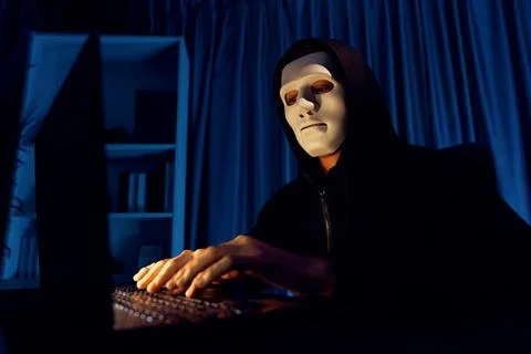White criminal anonymous mask installing coding password encryption. Pecuniary. 스톡 사진