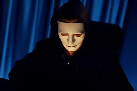 White criminal anonymous mask installing coding password encryption. Pecuniary. Stock-Fotos