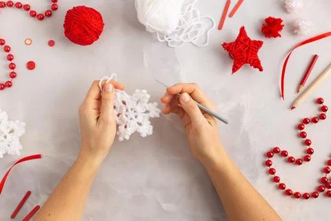 White crochet hooked snowflake with red ribbon Christmas decoration Stock Photos