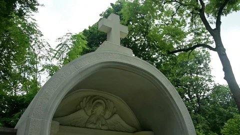 White cross on a background of green trees 스톡 동영상 115033401