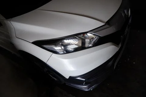 White Crossover Vehicle Partial View in Dark Garage Stock Photos