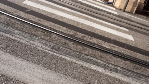 White crosswalk across parallel tram rails on asphalt road Video stock 151930792