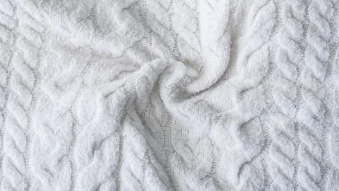 White crumpled cable knit wool sweater fabric texture close up Stock Photos