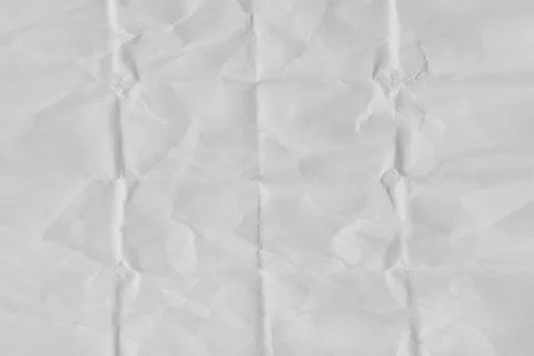 White crumpled paper texture with vertical and horizontal crease lines, fol.. Stock Photos