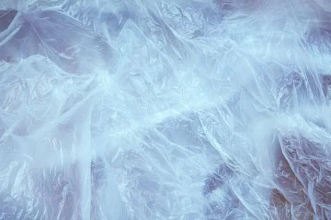 White crumpled plastic background close up polyethylene Stock Photos