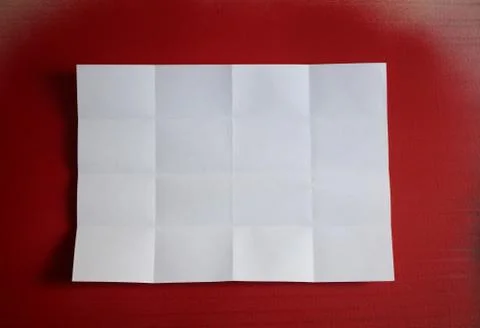 White crumpled sheet on red background Stock Photos