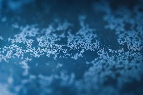 White crystal sediment pattern on blue surface Stock Photos