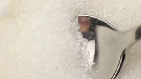 White crystal sugar in a teaspoon close-up macro Stock Footage 201112315