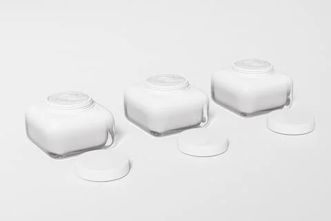 White cube shape cream jar with white flat lid mockup Illustrazione stock