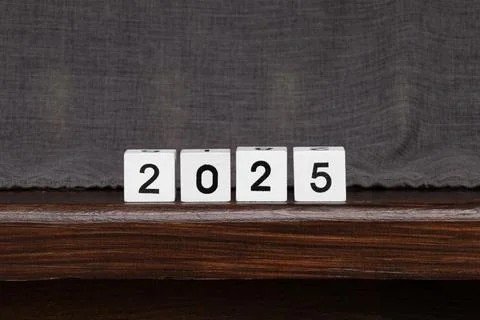 White cubes with black numbers lined up to represent the year 2025, cubes s.. Stock Photos