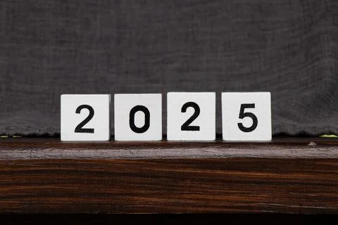 White cubes with black numbers lined up to represent the year 2025, cubes s.. Stock Photos