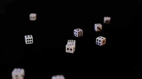 White cubes fall out, fly out on a black background for the game. Bones fall Stock Footage 129870840
