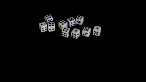 White cubes fall out, fly out on a black background for the game. The dice Stock Footage 129872792