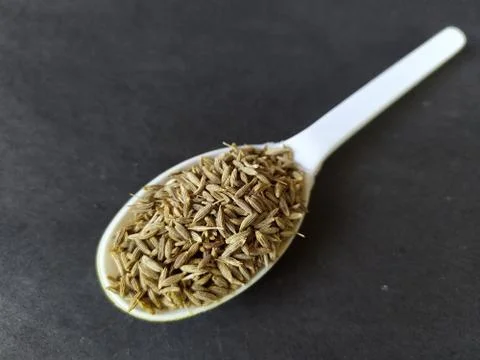 White cumin seeds in a spoon Stock Photos