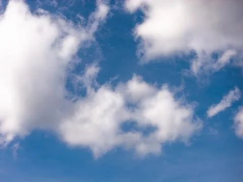 White Cumulus Cloud With Soft Shadows Against Blue Sky Stock Photos