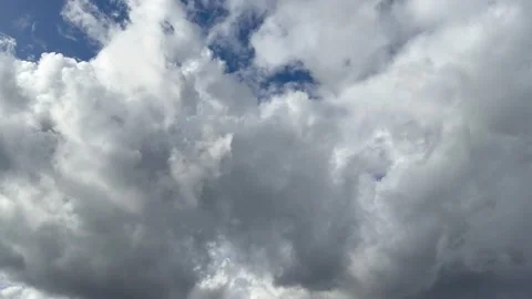 White cumulus clouds and stormy gray clouds Stock Footage 252514524