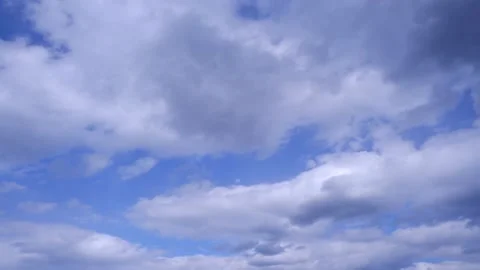 White cumulus clouds in the blue sky time lapse. Fast-moving clouds. 4K video Stock Footage 188570108