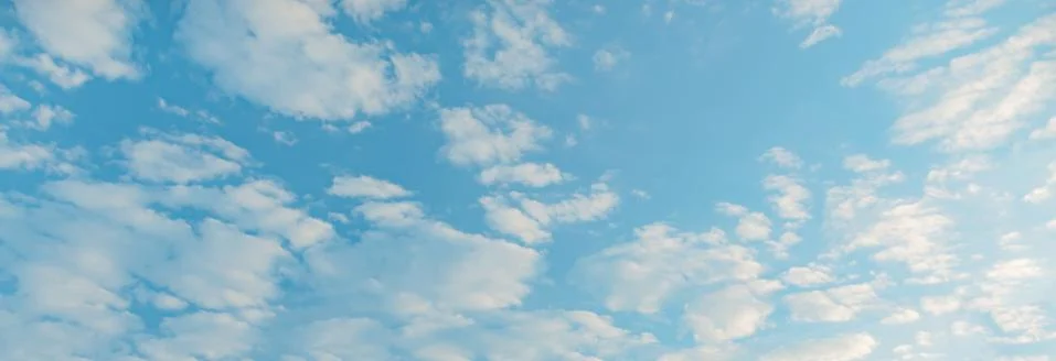 White Cumulus clouds in a blue sky Stock Photos