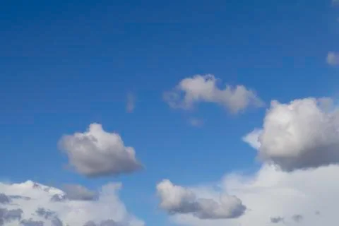 White cumulus clouds on blue sky. Stock Photos