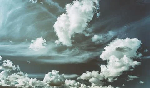 White cumulus clouds in the blue sky. Stock Photos