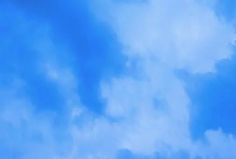 White cumulus clouds blue sky. Stock Photos