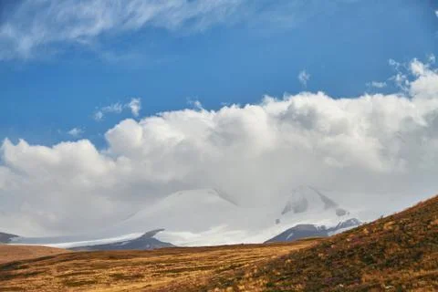 White Cumulus clouds come down from the mountains, autumn landscape in the st Stock-Fotos