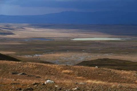 White Cumulus clouds come down from the mountains, autumn landscape in the st Stock Photos