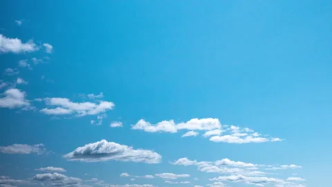 White Cumulus Clouds Drifting Across Blue Sky Time-Lapse, Summer Weather, Clean  Stock Footage 338003056