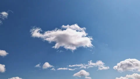 White Cumulus Clouds Drifting Across Bright Blue Sky Timelapse Stock Footage 345045849