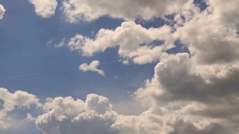 White cumulus clouds float on the blue sky. time-lapse Stock Footage 90301039