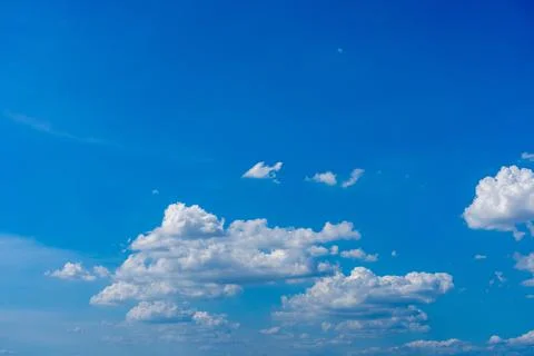 White cumulus clouds floating in the blue sky Stock-Fotos