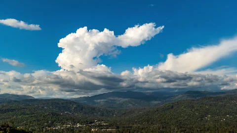 White Cumulus Clouds Form above California Sierra Nevada Town Time Lapse Stock Footage 280880501