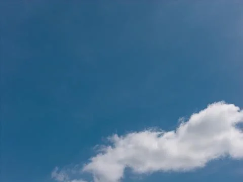 White cumulus clouds forming in blue sky on calm day Stock-Fotos