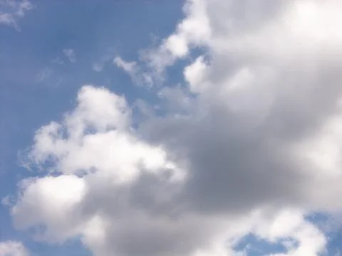 White Cumulus Clouds With Gray Undersides in Blue Sky Stock Photos