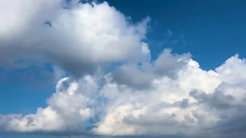 White cumulus clouds moving in blue sky Stock Footage 330175893