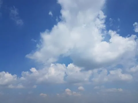 White cumulus clouds over blue sky Stock-Fotos