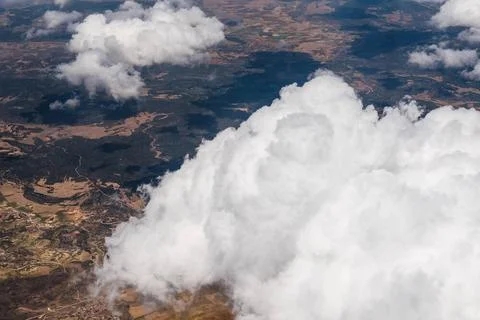 White Cumulus Clouds seen from Window of Airplane Large White Cumulus Clou... Stock Photos